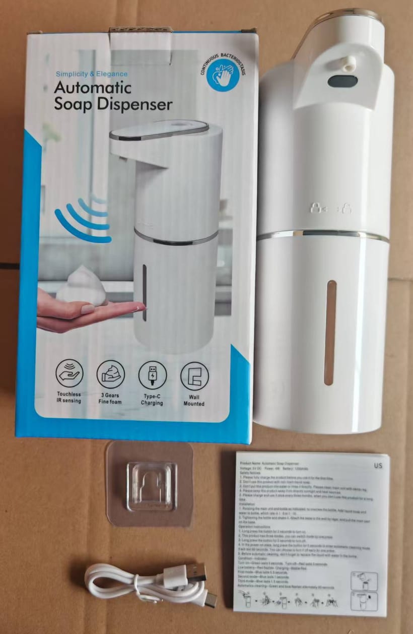 The Automatic Soap Dispenser with its box, wall holder, cable and leaflet