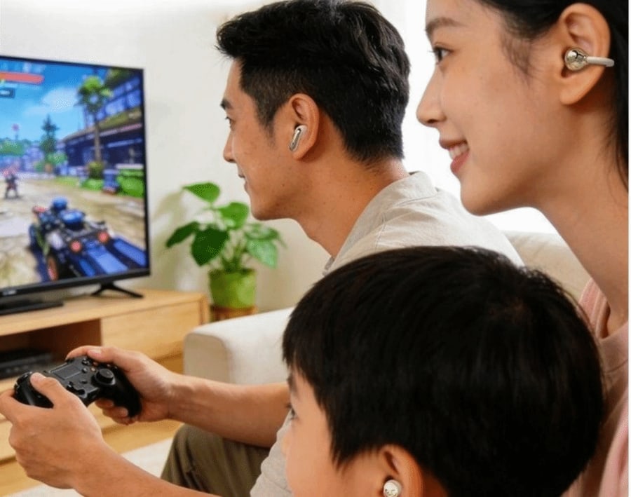A man, a woman and a child playing a game, each wearing a different pair of the 6-in-1 Earbuds